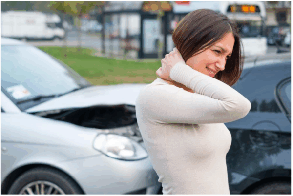 The_Top_5_Mistakes_to_Avoid_After_a_Car_Accident__A_Lawyer_s_Perspective_docx_-_Google_Docs Woman with neck pain after car accident, standing beside two collided cars on street.