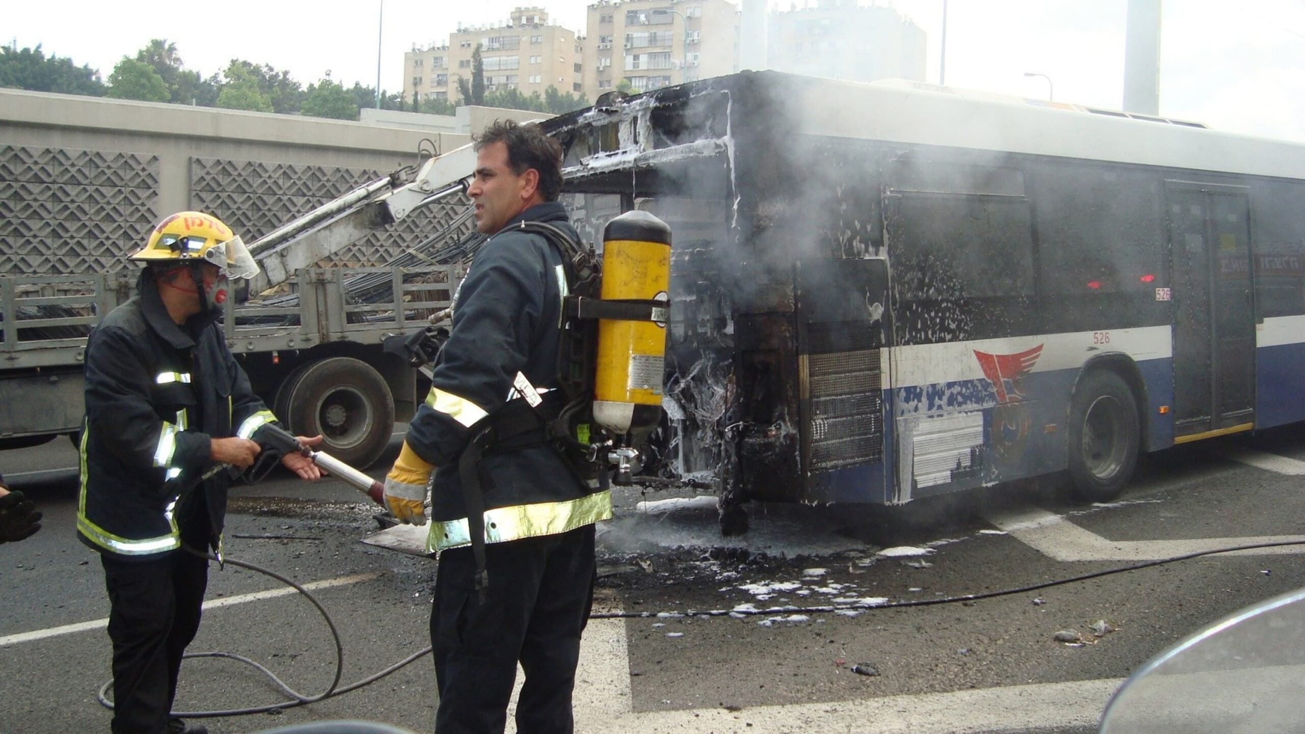 Legal rights of passengers injured in bus accidents shown as passenger receives help