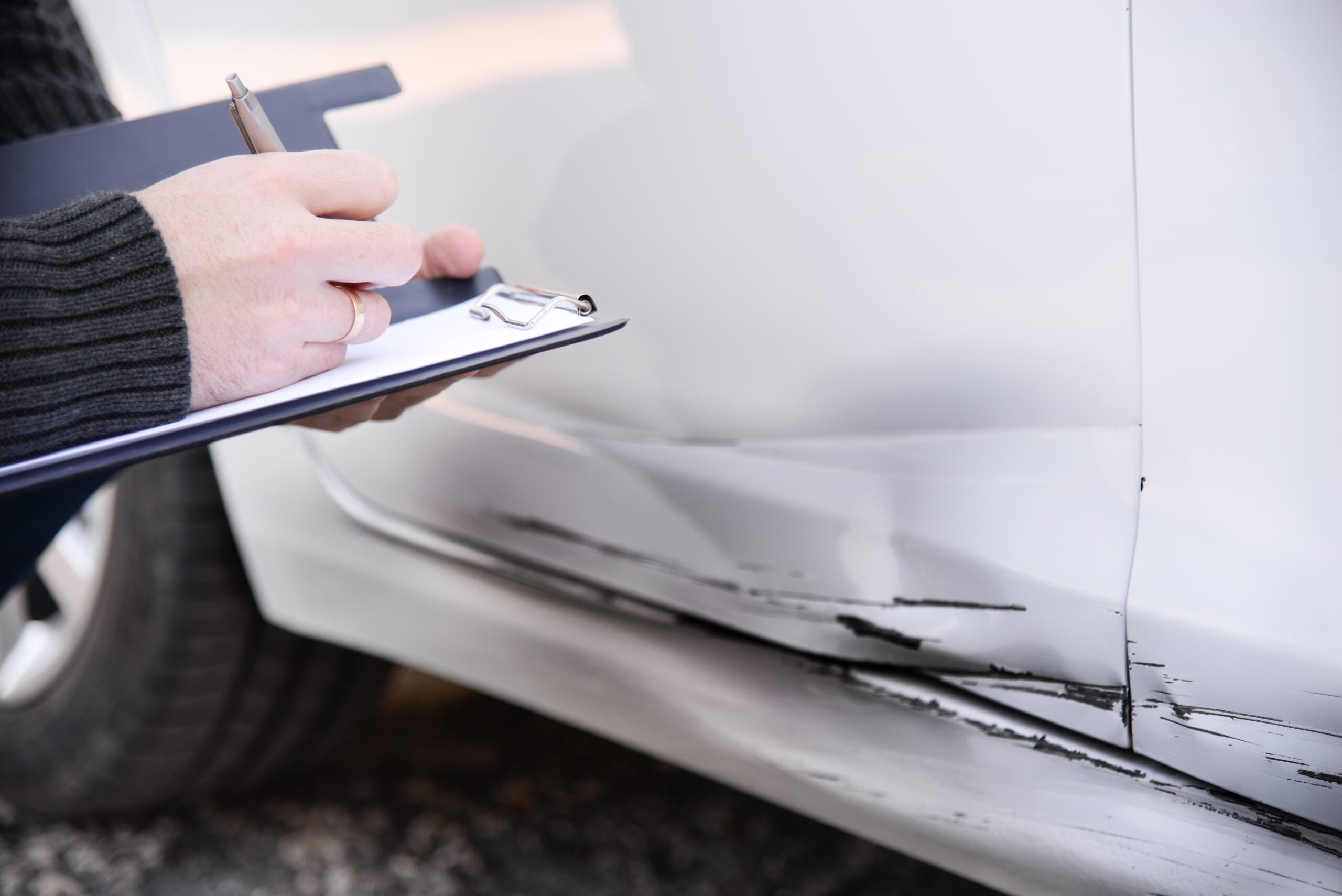 Person collecting evidence after a rideshare collision to preserve their legal claim