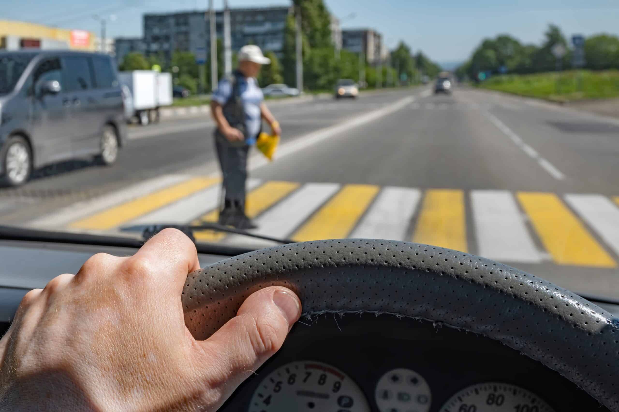driver yielding to pedestrian at crosswalk safety