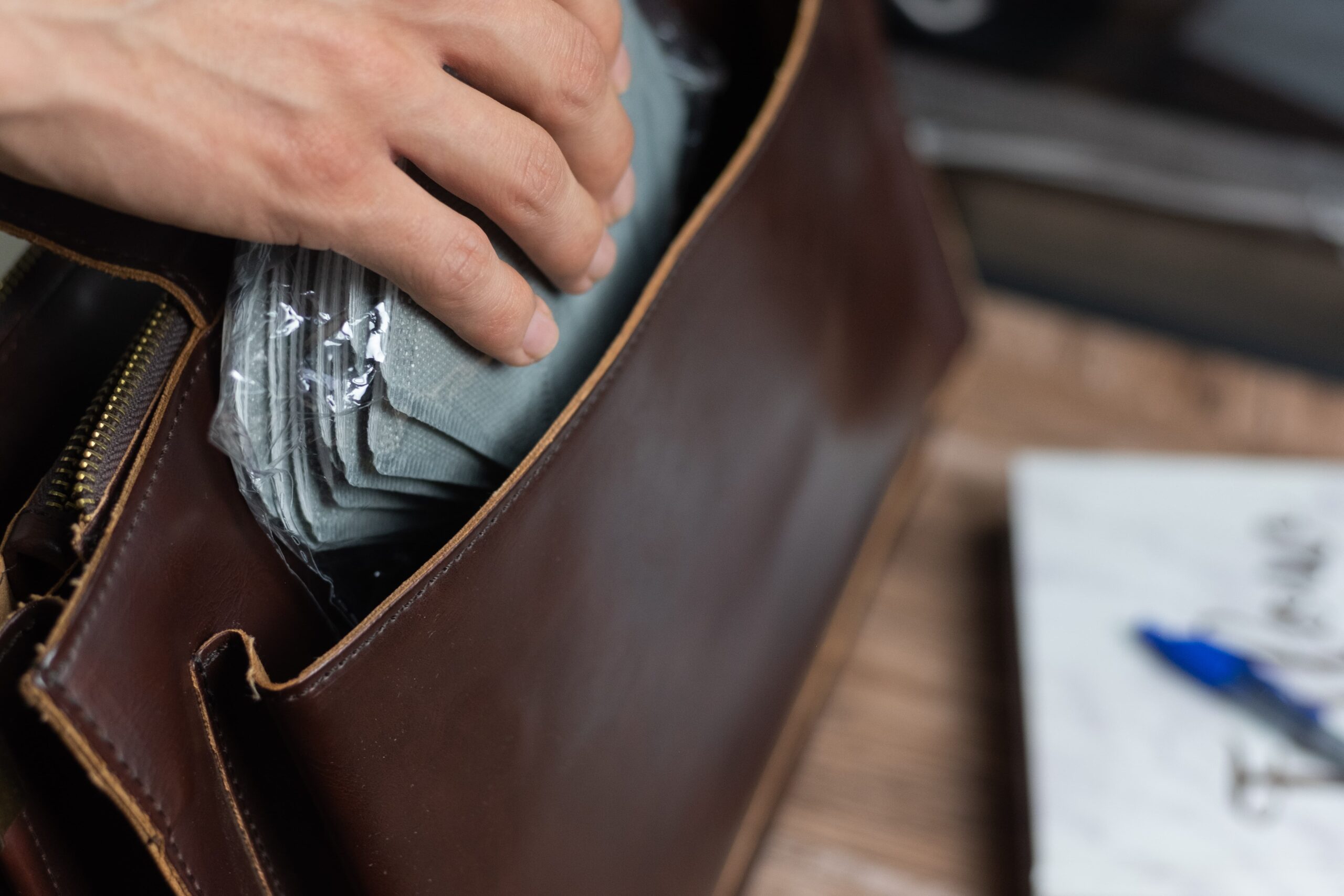 Hand calculating economic and non-economic compensation for a dog bite injury claim.