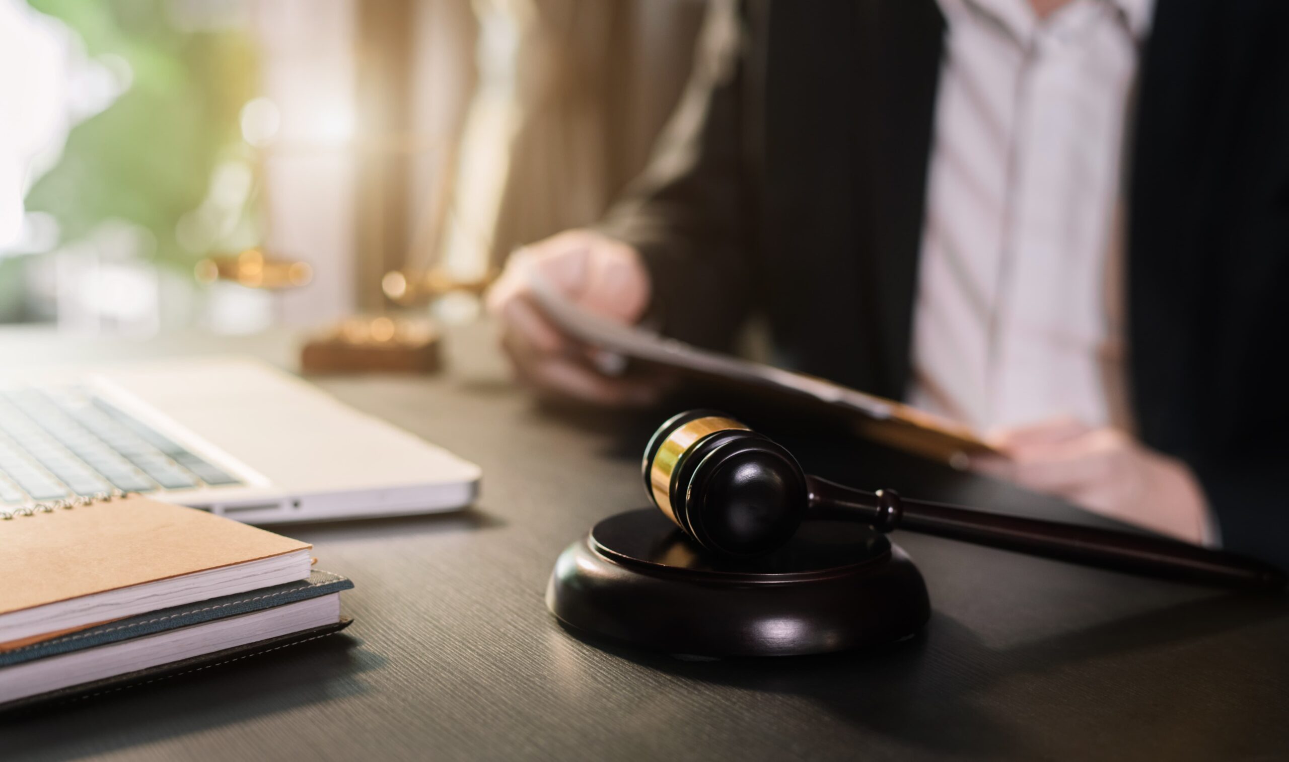 Legal gavel and paperwork symbolizing the action to prove negligence in a slip and fall case.