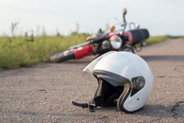 motorcycle-helmet-legal-claim Motorcycle helmet injury claims visual, showing a helmet and legal documents.