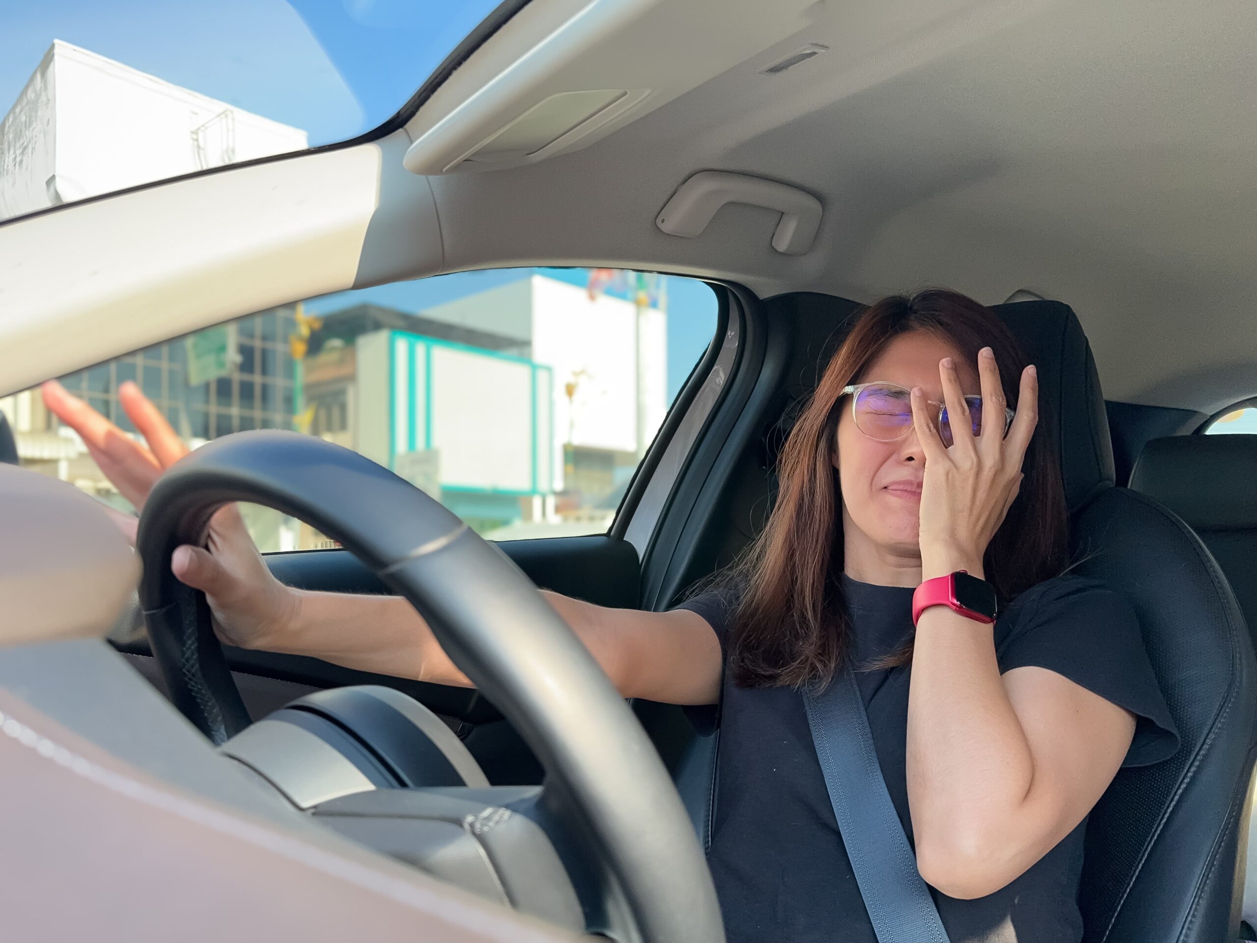 Person experiencing anxiety behind the wheel after an accident related to an emotional distress claim in California
