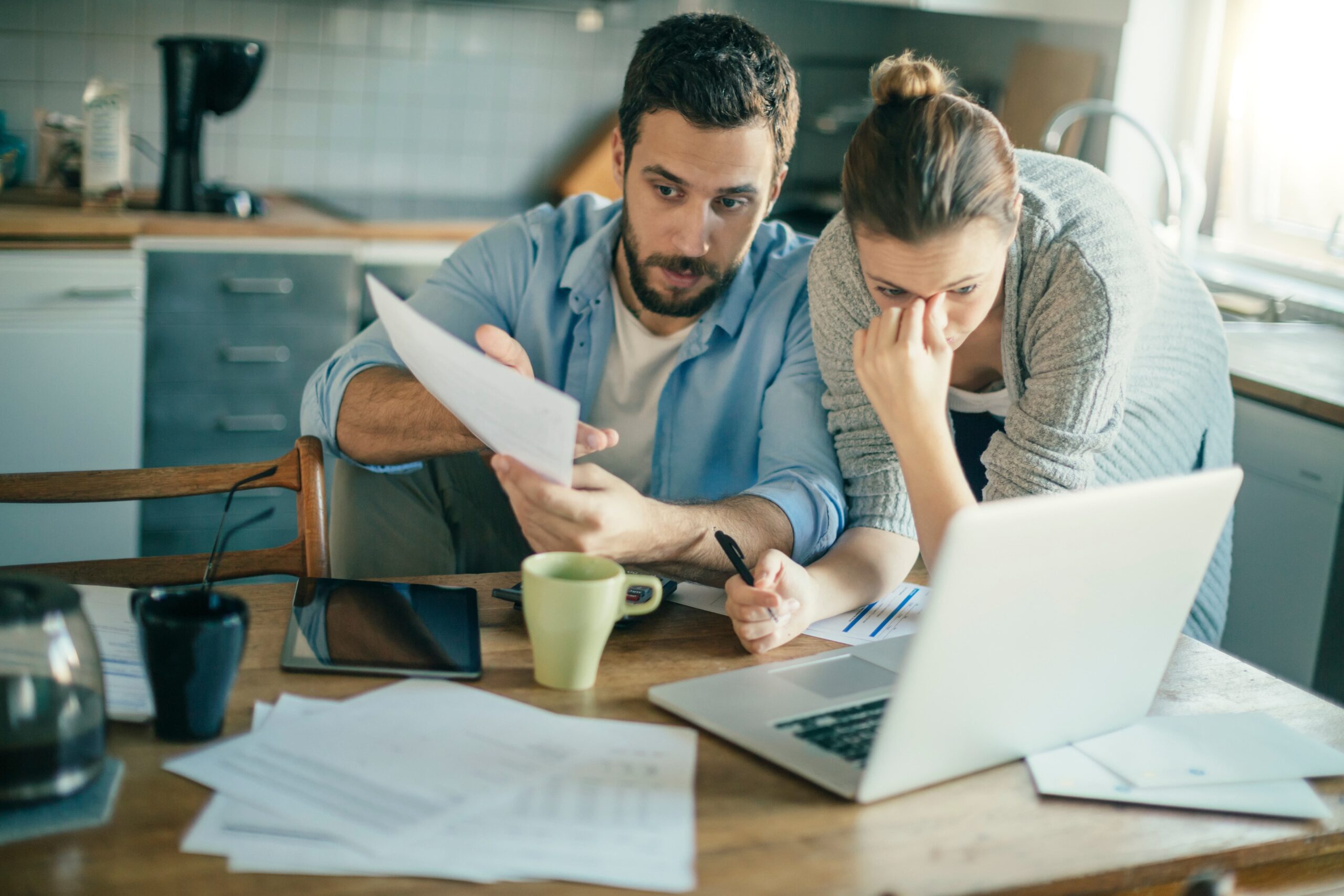 Person reviewing insurance paperwork deciding if they need a personal injury lawyer