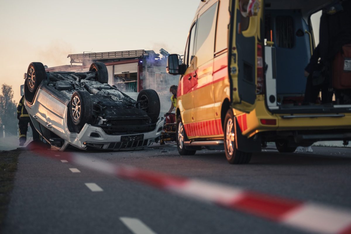 cars involved in highway accident with first responders assisting at the scene