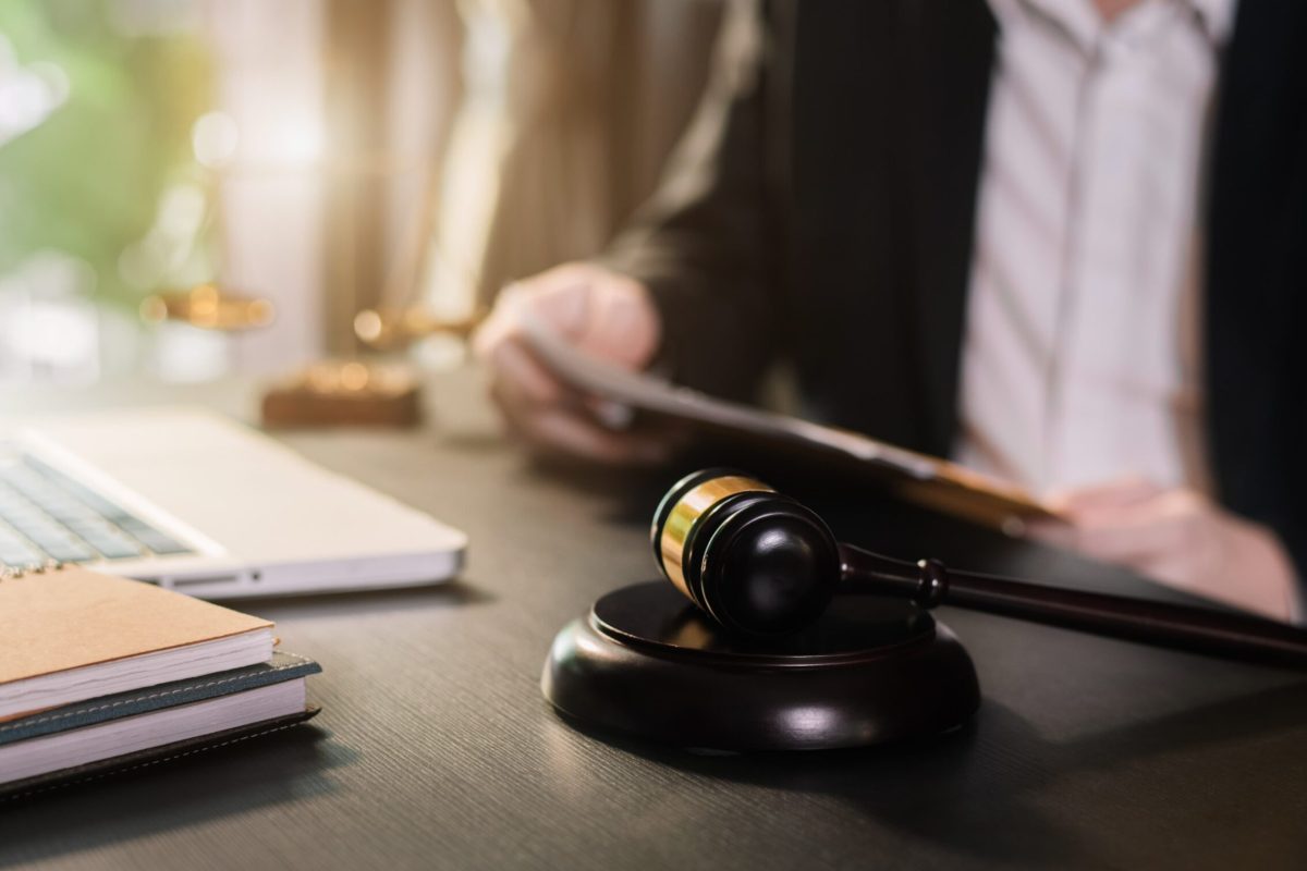 Legal gavel and paperwork symbolizing the action to prove negligence in a slip and fall case.